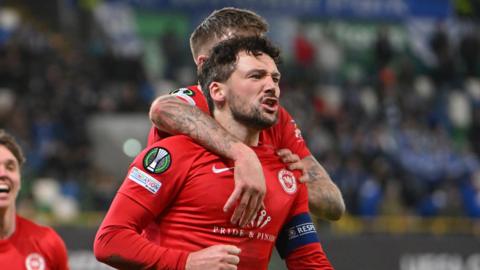 Tomas Cosgrove celebrates scoring for Larne