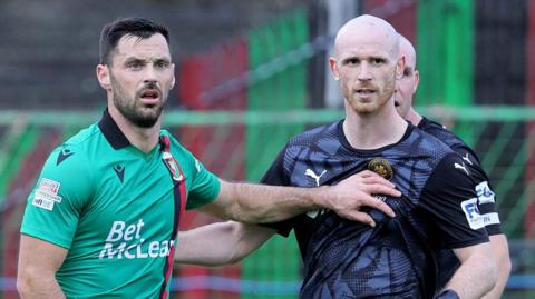 Pat Hoban and Joe Crowe jostle for position