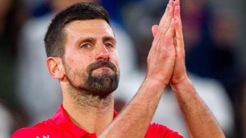 Novak Djokovic acknowledges the French Open crowd