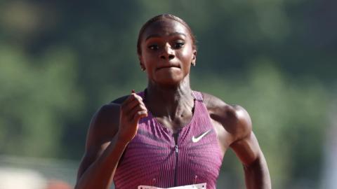 Dina Asher-Smith runs to the finish line