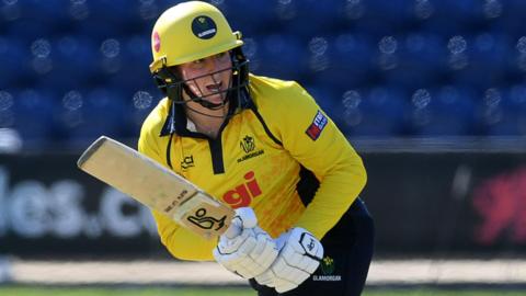 Lauren Parfitt plays a shot and runs