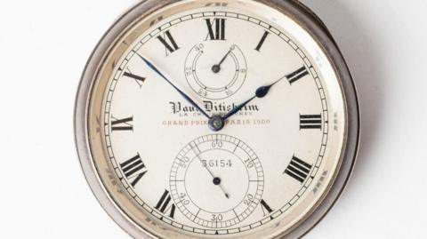 The Paul Ditisheim deck watch has a dial signed Paul Ditisheim, La Chaux-de-Fonds, Grand Prix Paris 1900, with Roman numeral times and blued steel hands.