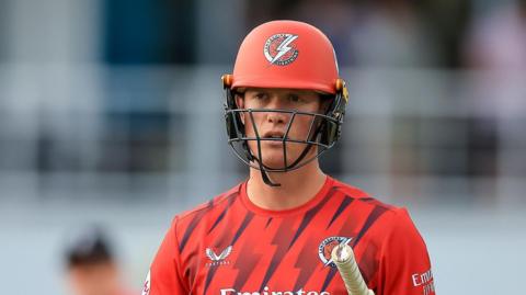 Keaton Jennings walking off with his bat under his arm 