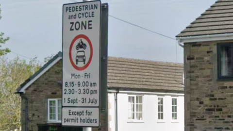 A sign restricting vehicles on a street in Bradford