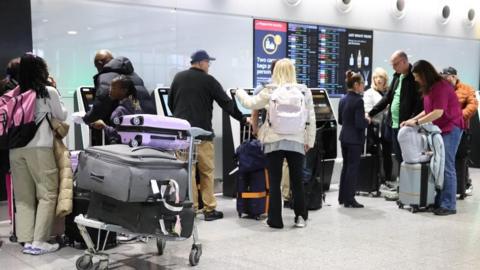 Passengers at Heathrow Airport.