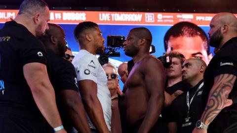 Anthony Joshua faces off with Daniel Dubois at the weigh-in