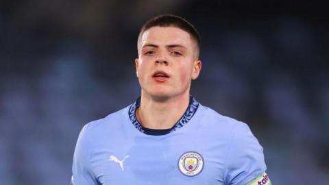 Will Dickson playing for Manchester City