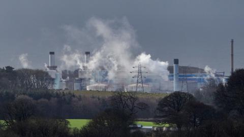 Nuclear power plant with plumes in the air