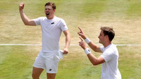 Henry Patten and Harri Heliovaara celebrate after reaching the men's doubles quarter-finals