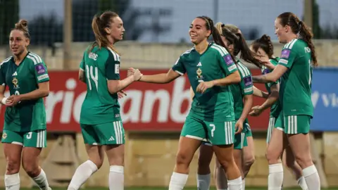 Ellie Mason celebrates