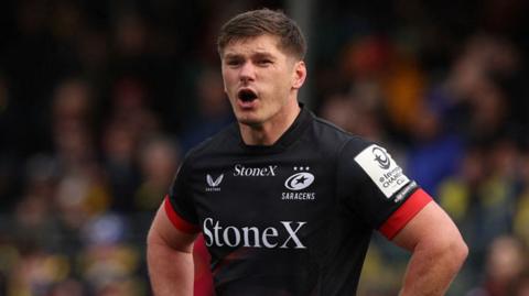Saracens star Owen Farrell looks on 