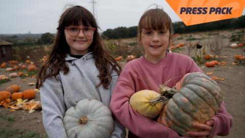 girls with pumpkins