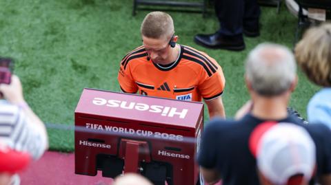 Referee checks VAR screen for Croatia goal