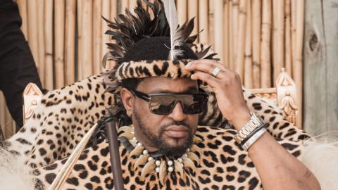 King Misuzulu kaZwelithini is pictured in sunglasses and leopard print ceremonial clothing