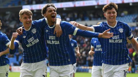 Joel Bagan, Omari Kellyman and Rubin Colwill celebrate Cardiff's goal against Bolton Wanderers