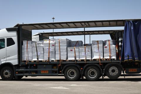 A truck carrying aid waits to enter the Gaza Strip at the Kerem Shalom crossing, southern Israel