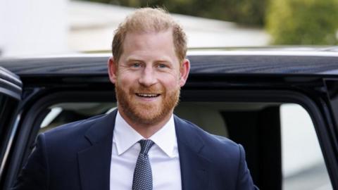 Prince Harry getting out of car