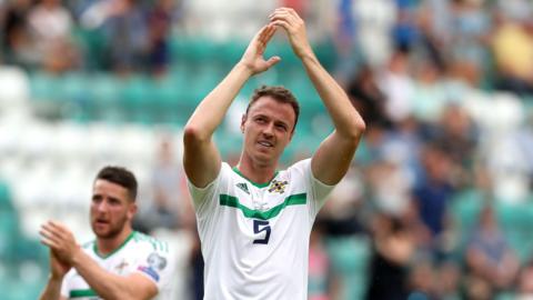 Jonny Evans applauds the Northern Ireland fans