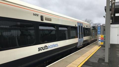 The outside of a Southeastern train in a station