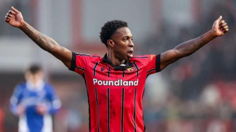 Walsall and Guyana midfielder Liam Gordon celebrates a Saddlers victory