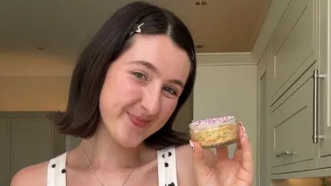 Chloe Rose Steen with her homemade dot cake