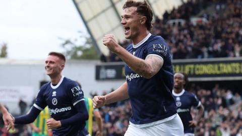 Jake Cooper [right] celebrates after scoring for Millwall against West Bromwich Albion