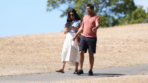 People walking through Primrose Hill, north London, on 9 August 2026