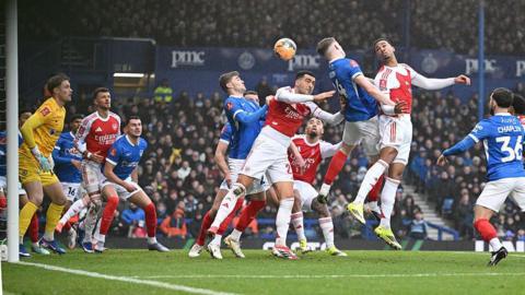 Arsenal look to score from a corner against Portsmouth in their FA Cup match at Fratton Park