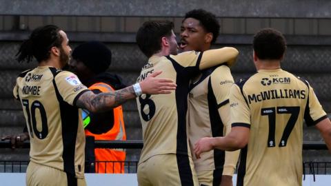 Rotherham celebrate scoring at Exeter City