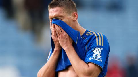Jannik Vestergaard of Leicester City looks dejected after their defeat by Swansea