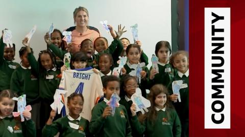 Chelsea captain Millie Bright with local schoolchildren