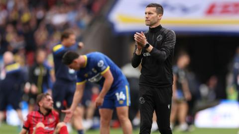 Walsall boss Mat Sadler looking dejected after losing to AFC Wimbledon in the League Two play-off final