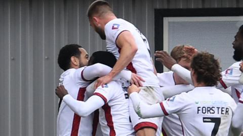 Crawley celebrate scoring at Newport County