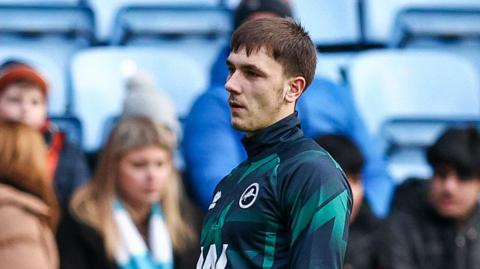 Adam Mayor warming up before a game for Millwall
