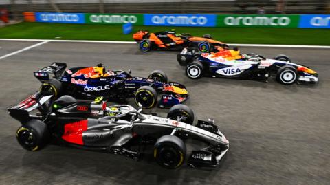 Audi's Gabriel Bortoleto, Red Bull's Max Verstappen, Racing Bulls' Arvid Lindblad and McLaren's Norris practise their race starts during pre-season testing in Bahrain