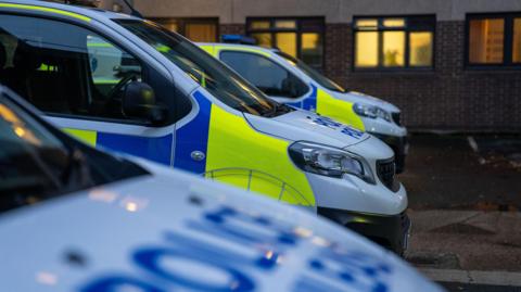 Three police vans in a row