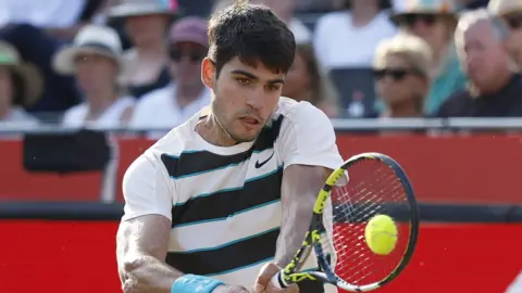 Carlos Alcaraz hits a forehand