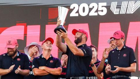 Jon Rahm holds up the 2025 LIV Golf team championship trophy beside his of Legion XIII team-mates