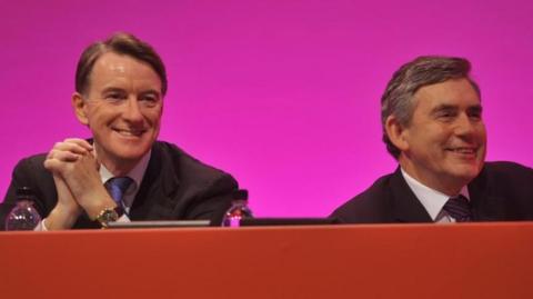 Peter Mandelson and Gordon Brown sitting on stage together at Labour Party conference 