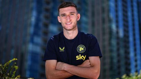 Mason Melia posing in a photoshoot while with Ireland