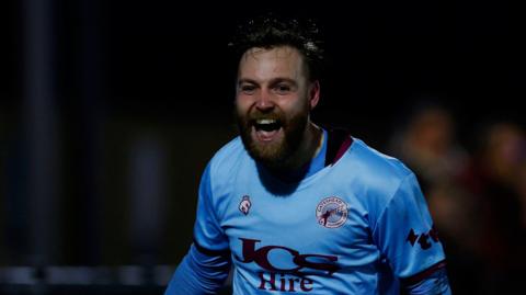 Gateshead's Harry Chapman celebrates scoring at Truro