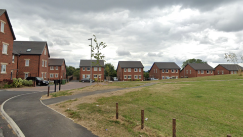 Monet Close in Chapel Allerton, a modern housing estate with green open space in the centre.