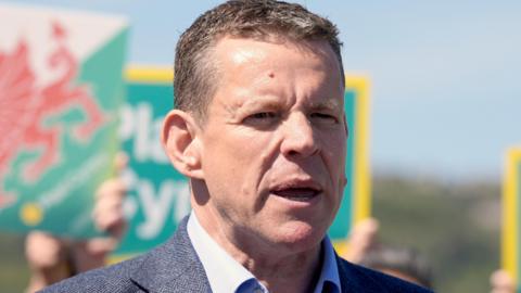 Rhun ap Iorwerth looking to the right of the picture
