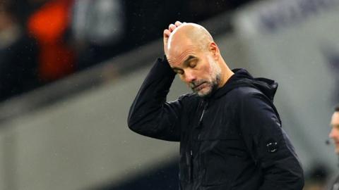 Pep Guardiola scratches head with eyes closed