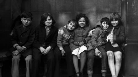 Children captured in a photo by John Dean in 1976