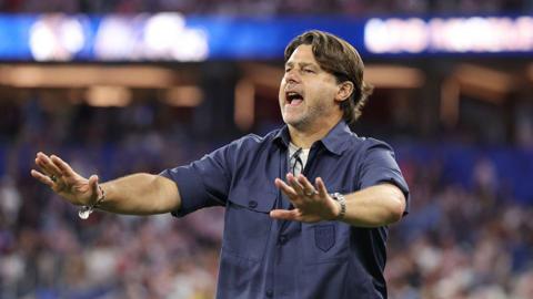 United Stats head coach Mauricio Pochettino gestures to his players with his arms outstretched 
