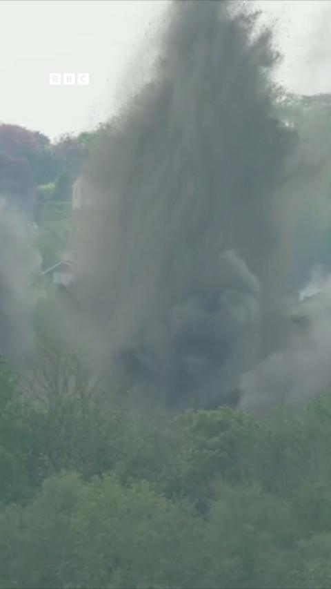 Lots of sand and debris flies into there are as a WW2 bomb is detonated