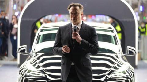 Tesla CEO Elon Musk speaks during the official opening of the new Tesla electric car manufacturing plant on March 22, 2022 near Gruenheide, Germany