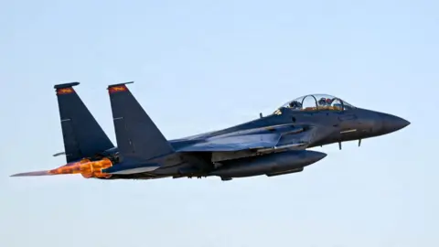 An F-15E Strike Eagle takes off for a combat flight