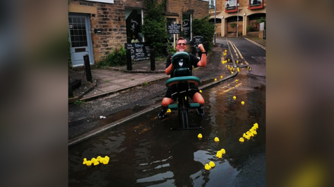 Dean Majors, pictured next to the burst pipe